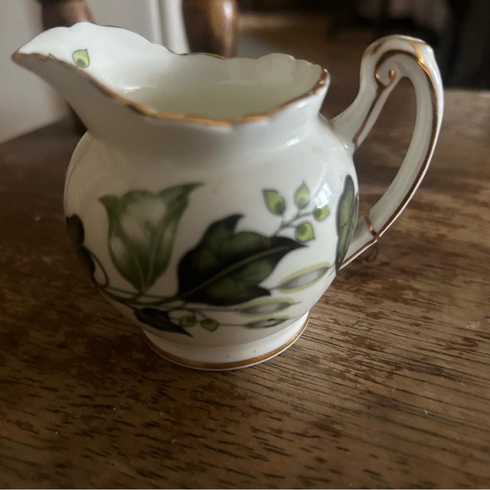 Elegant Green and White Ceramic Pitcher